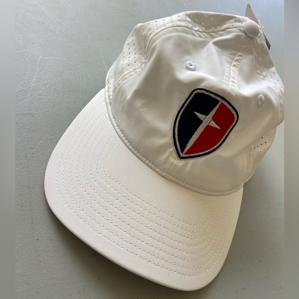 Tennis hat. New with tag. Cross red and blue with white cap. Cornerstone